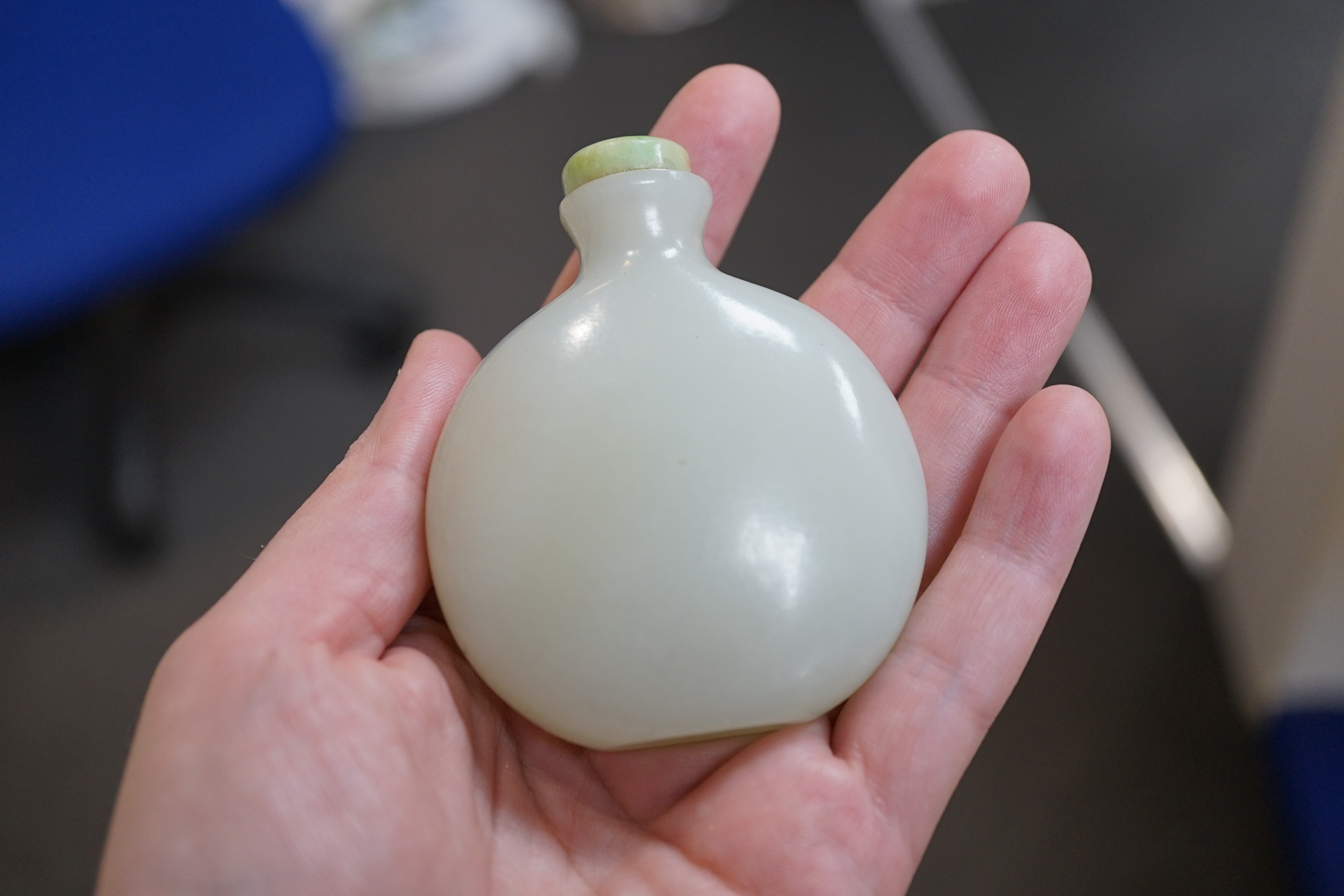 A Chinese pale celadon jade snuff bottle, of moonflask form, 19th century